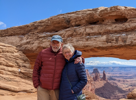 Couple at Canyonlands Mesa Arch National Park