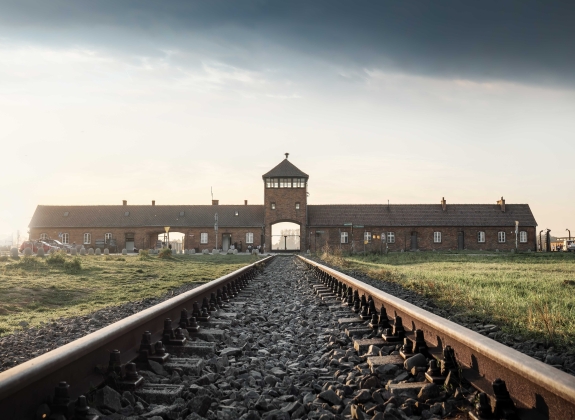 Railroad Track and the Gate of Death - Entrance of Auschwitz II - Birkenau, former German Nazi Concentration and Extermination Camp - Poland