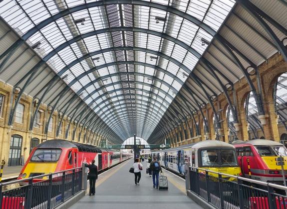 A train station with 2 platforms, trains ready to board