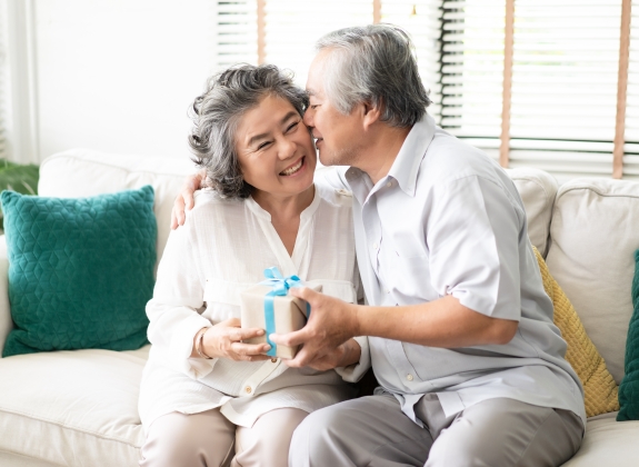 happy couple celebrating a special occasion with presents