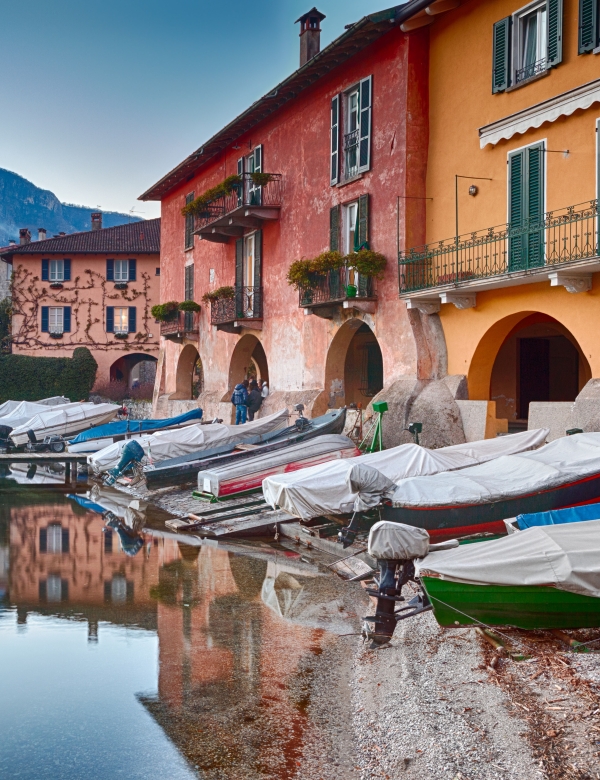 boats on calm waters of lake como, italy