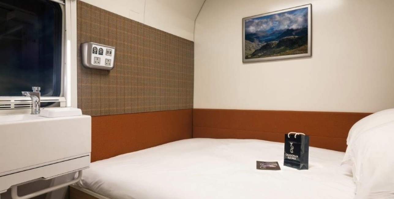 A double bed inside a train cabin