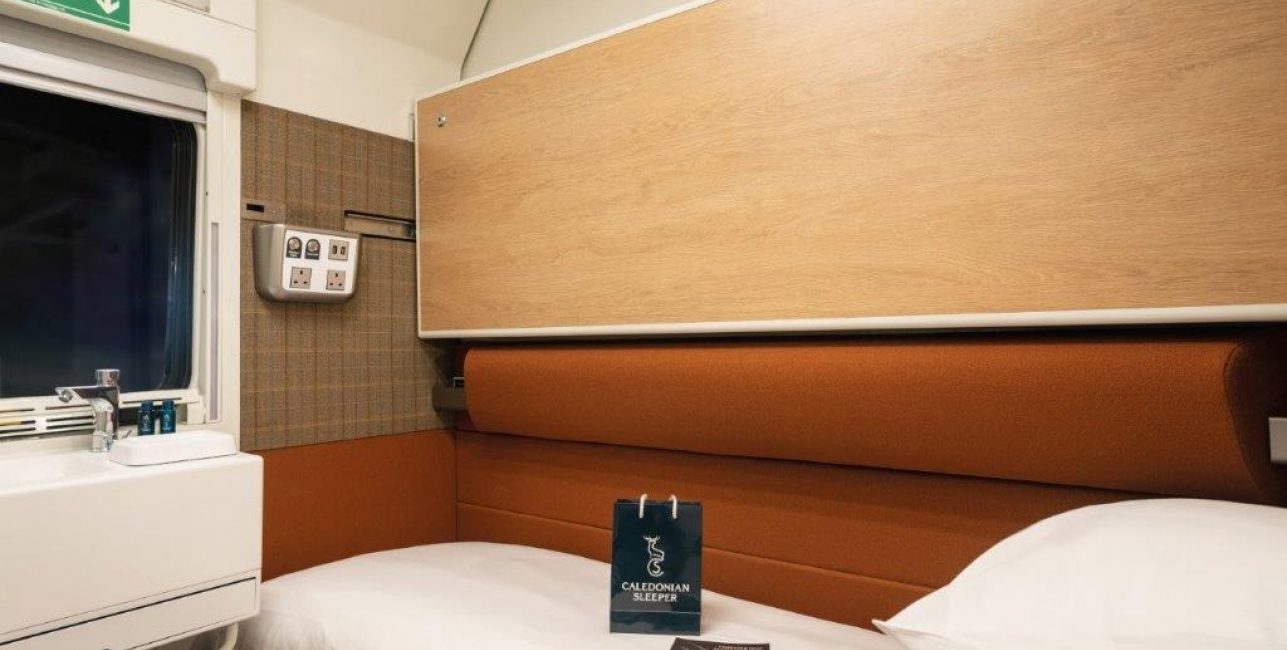 Inside a train cabin with single bed