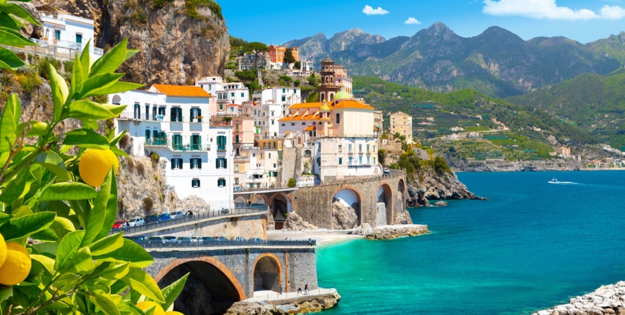 Beautiful view of Amalfi on the Mediterranean coast with lemons in the foreground, Italy