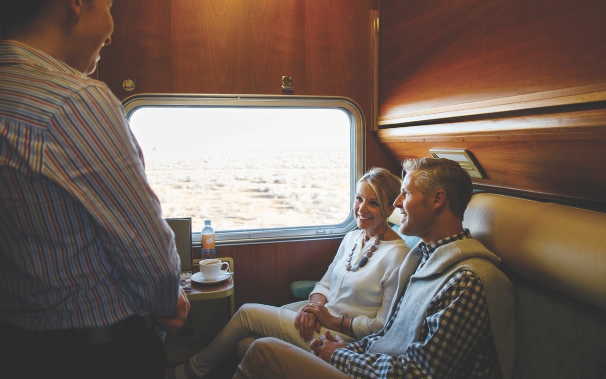 A couple sat in a twin cabin onboard the train