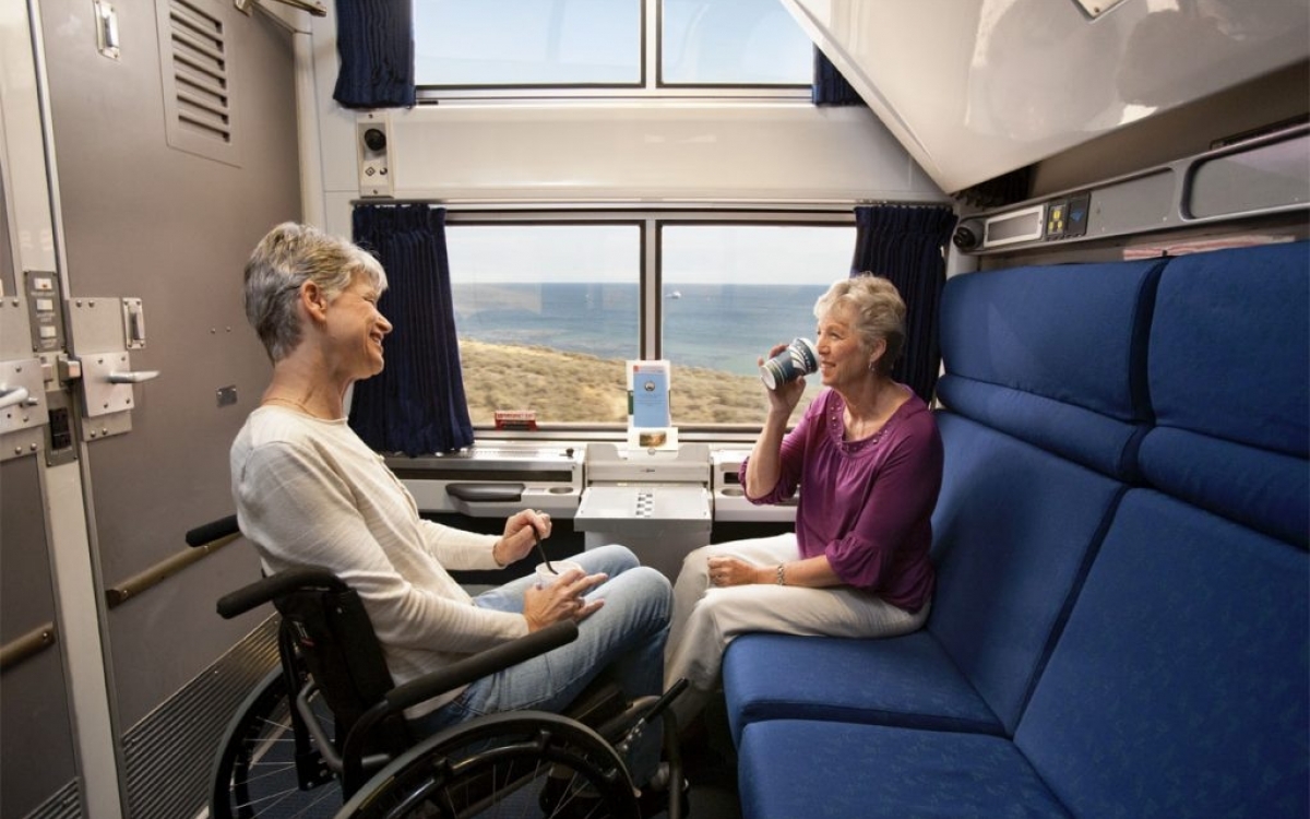 friends relaxing in Amtrak's accessible bedroom