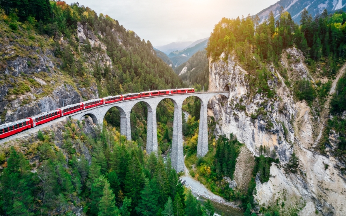 Train crossing Landwasser Viaduct on raethian railway in Filisur