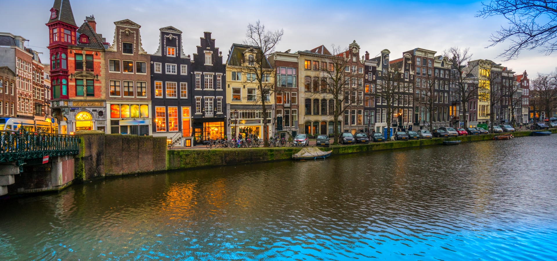 Evening city view of Amsterdam, the Netherlands with Amstel river