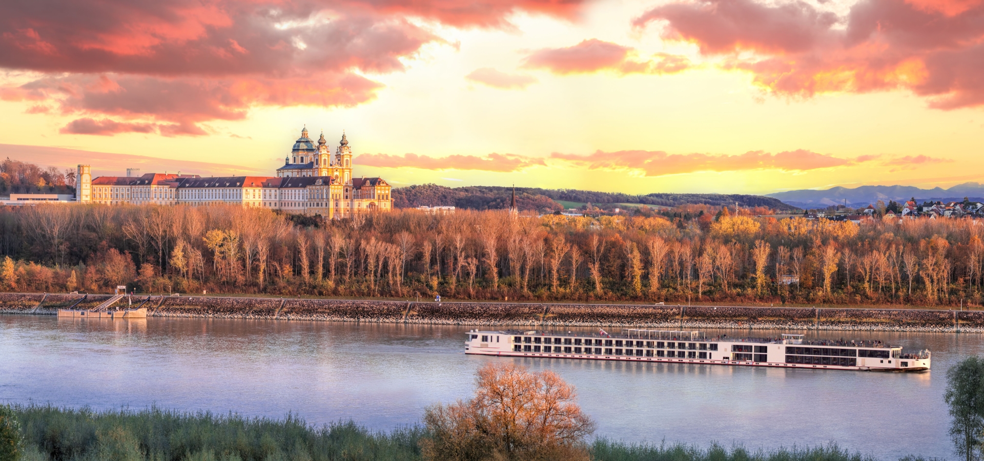 Panorama of Melk abbey with Danube river and autumn forest in Wachau, Austria