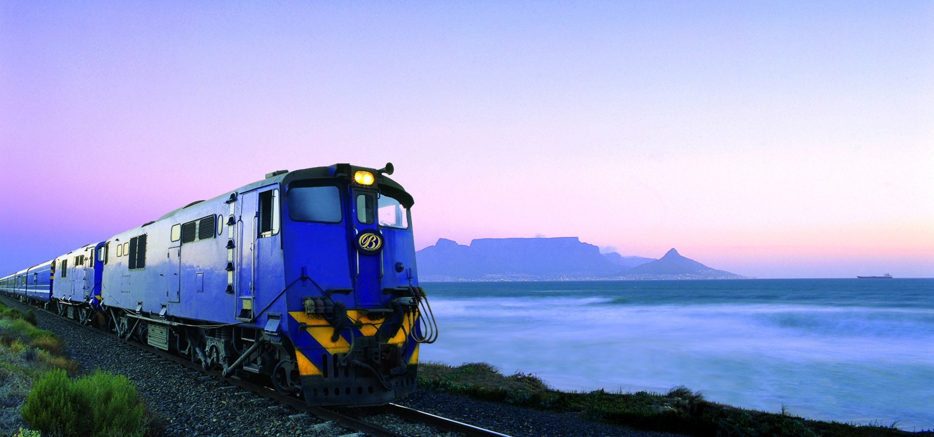 A Train on the tracks at sunset