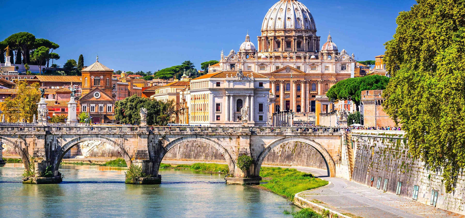 St. Peter's Basilica in Vatican City, as seen across the Tiber River in Rome, Italy