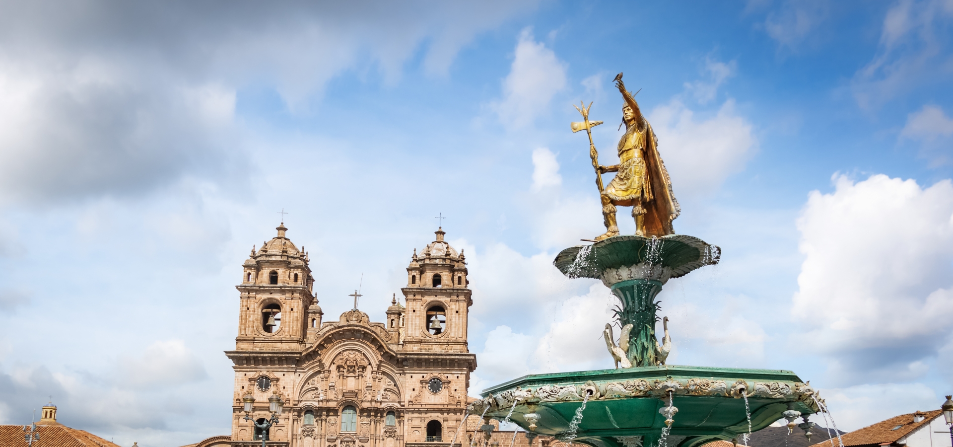 Panoramic view of Plaza de Armas with Inca fountain, Cathedral and Compania de Jesus Church - Cusco, Peru