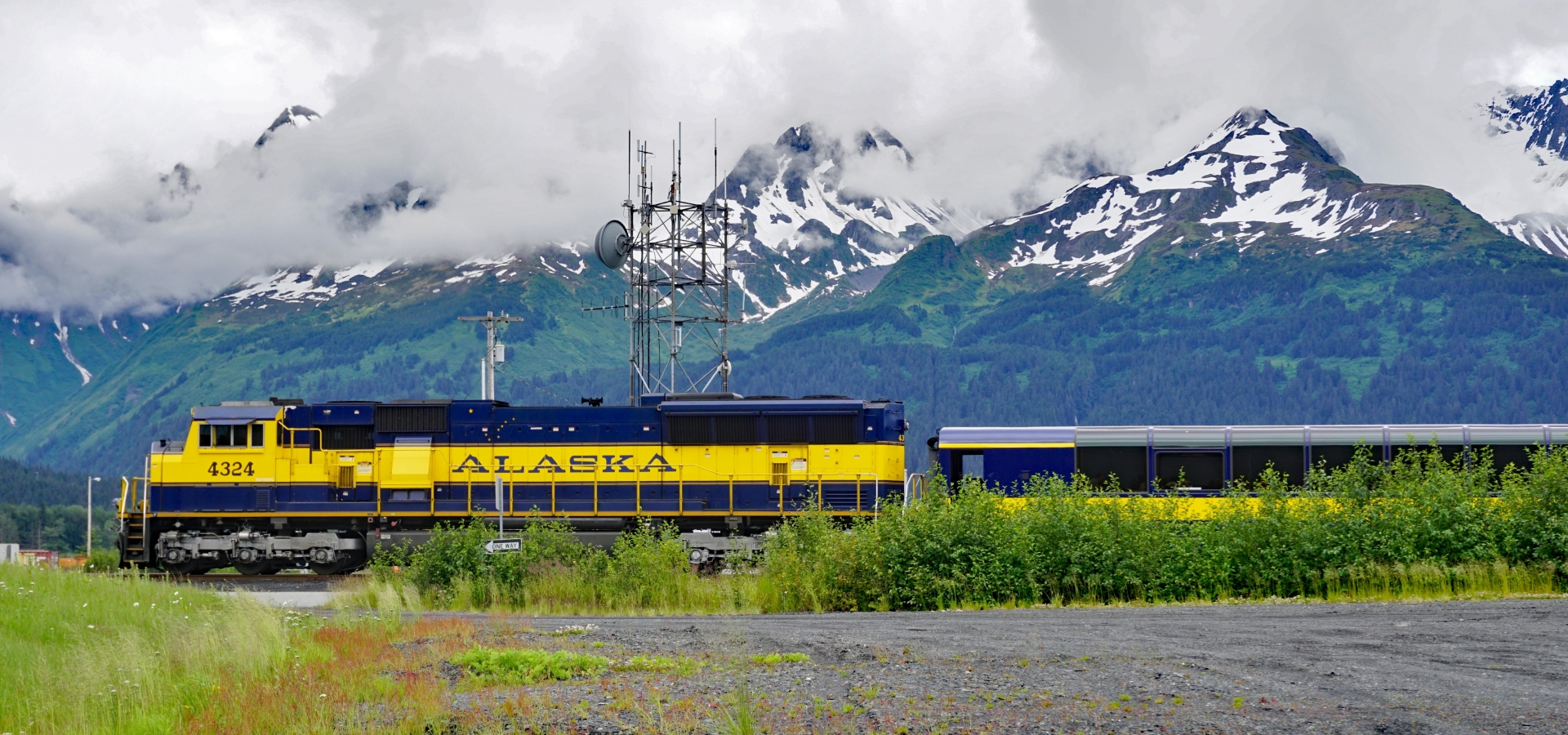 Alaska Railroad train exterior by mountains