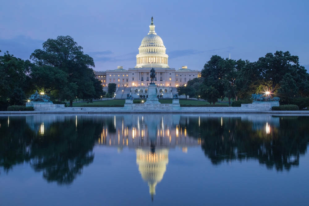 capitol- building reflection at night in washington, dc