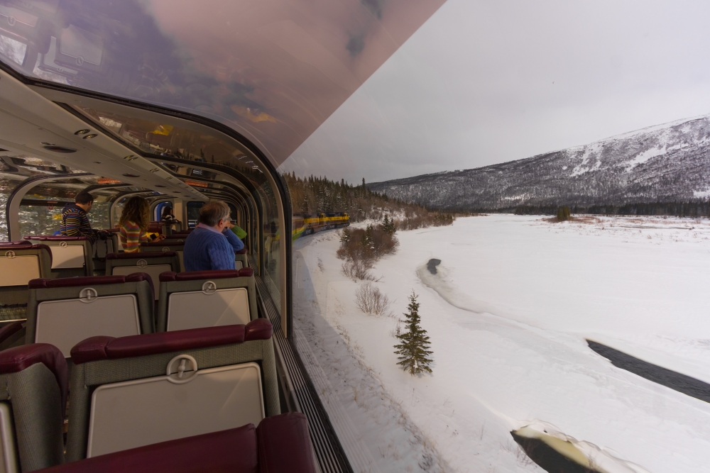 snow vie wof the outside on the alaska railroad train